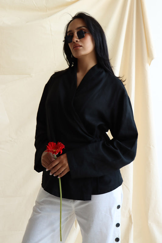 wearing a black wrap-tie-up linen shirt, with full sleeves and easy fit