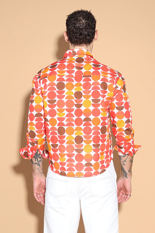 Exude a fun retro vibe of the sixties and seventies that makes for a fun look in this shirt. In warm tones of reds, oranges and yellows, the overall circle print shirt has a shirt collar and front button closure with full sleeves. Trimmed and complimented with white details that finish off the look giving it just the polished look needed. Style this fun retro shirt with white pants or denims or white shorts.