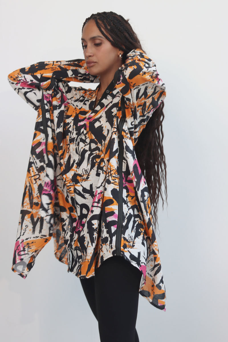 Graffiti print shirt with front button down and full sleeves with black ribbon trims and back tie with eyelets