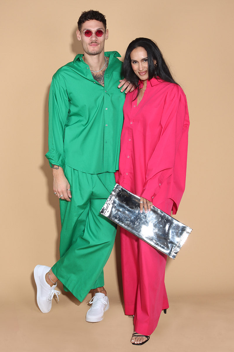 In Emerald green jewel tone, the twin co-ord set unisex, menswear and womenswear with an oversized shirt and wide leg pants with a drawstring and elasticated waist are your perfect go to for the season. They're an oversized fit, looser and baggier in their styling, and designed to be worn in a very casual manner. the separates can be styled together for a statement look or separately.