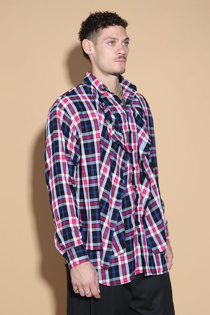 An easy shirt that sashays with your every move. The Sway Drape shirt in Cotton has an overall check in tones of purples and pinks. The shirt has a shirt collar and front button closure, with a double layer front with button and button-holes to create optional drape effect.