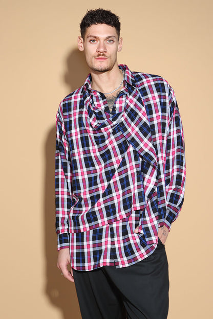 An easy shirt that sashays with your every move. The Sway Drape shirt in Cotton has an overall check in tones of purples and pinks. The shirt has a shirt collar and front button closure, with a double layer front with button and button-holes to create optional drape effect.