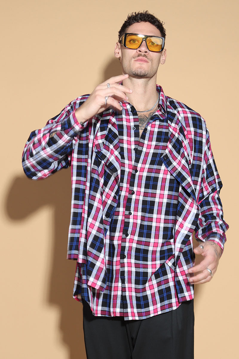 An easy shirt that sashays with your every move. The Sway Drape shirt in Cotton has an overall check in tones of purples and pinks. The shirt has a shirt collar and front button closure, with a double layer front with button and button-holes to create optional drape effect.