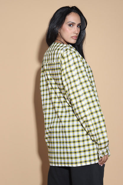 Add a little punk 70s element to your look with this check shirt that is all sorts of fabulous. In yellow, blacks and white check, The shirt has a sleeve and shoulder button through closure. Giving you styling options between opting for a boat neck opening or open up the buttons for a cowl neck it can be styled what suits your style. The sleeve buttons can be opened up too, to style it as a full sleeve top, or get your arms out at any length you like.