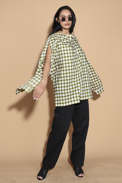 Add a little punk 70s element to your look with this check shirt that is all sorts of fabulous. In yellow, blacks and white check, The shirt has a sleeve and shoulder button through closure. Giving you styling options between opting for a boat neck opening or open up the buttons for a cowl neck it can be styled what suits your style. The sleeve buttons can be opened up too, to style it as a full sleeve top, or get your arms out at any length you like.