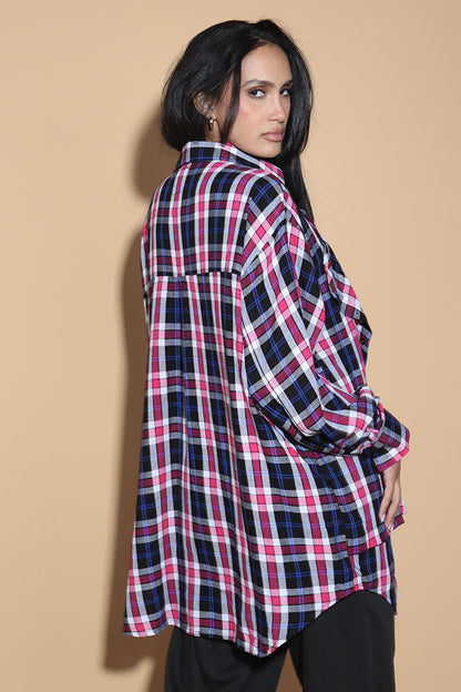 An easy shirt that sashays with your every move. The Sway Drape shirt in Cotton has an overall check in tones of purples and pinks. The shirt has a shirt collar and front button closure, with a double layer front with button and button-holes to create optional drape effect.