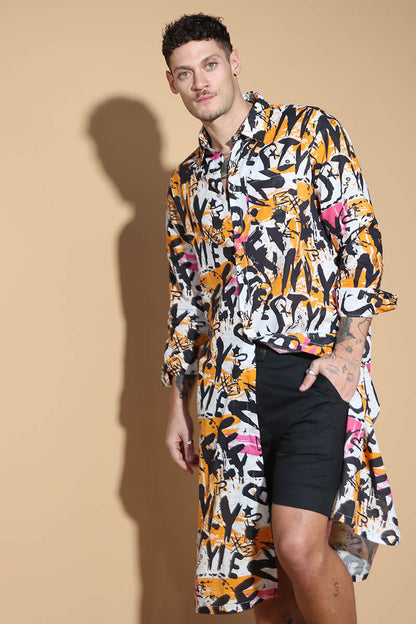Go for a long tunic shirt that features our signature overall graffiti print that turns the heads for all the right reasons. The bold overall graffiti print showcases your individual personality marching to the beat of your own drum. In a textured Khaddar Cotton, the kurta tunic has a shirt collar and front button closure with side slits.