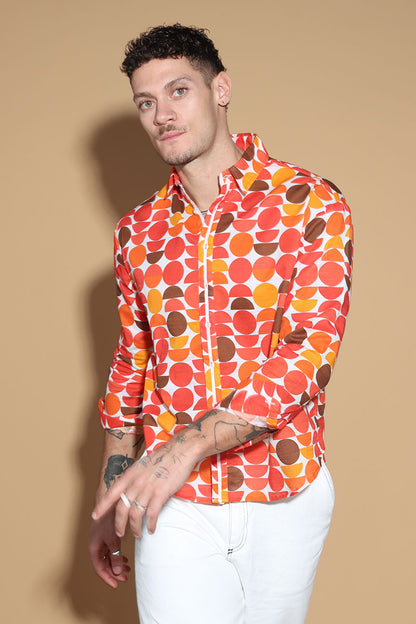 Exude a fun retro vibe of the sixties and seventies that makes for a fun look in this shirt. In warm tones of reds, oranges and yellows, the overall circle print shirt has a shirt collar and front button closure with full sleeves. Trimmed and complimented with white details that finish off the look giving it just the polished look needed. Style this fun retro shirt with white pants or denims or white shorts.