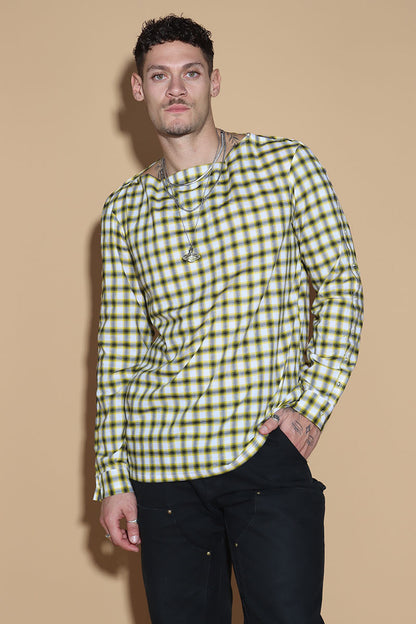 Add a little punk 70s element to your look with this check shirt that is all sorts of fabulous. In yellow, blacks and white check, The shirt has a sleeve and shoulder button through closure. Giving you styling options between opting for a boat neck opening or open up the buttons for a cowl neck it can be styled what suits your style. The sleeve buttons can be opened up too, to style it as a full sleeve top, or get your arms out at any length you like.