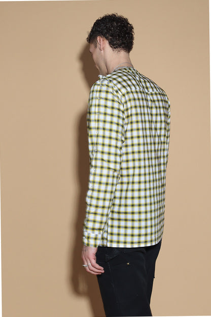 Add a little punk 70s element to your look with this check shirt that is all sorts of fabulous. In yellow, blacks and white check, The shirt has a sleeve and shoulder button through closure. Giving you styling options between opting for a boat neck opening or open up the buttons for a cowl neck it can be styled what suits your style. The sleeve buttons can be opened up too, to style it as a full sleeve top, or get your arms out at any length you like.