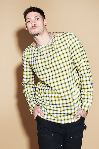Add a little punk 70s element to your look with this check shirt that is all sorts of fabulous. In yellow, blacks and white check, The shirt has a sleeve and shoulder button through closure. Giving you styling options between opting for a boat neck opening or open up the buttons for a cowl neck it can be styled what suits your style. The sleeve buttons can be opened up too, to style it as a full sleeve top, or get your arms out at any length you like.