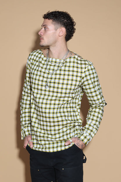 Add a little punk 70s element to your look with this check shirt that is all sorts of fabulous. In yellow, blacks and white check, The shirt has a sleeve and shoulder button through closure. Giving you styling options between opting for a boat neck opening or open up the buttons for a cowl neck it can be styled what suits your style. The sleeve buttons can be opened up too, to style it as a full sleeve top, or get your arms out at any length you like.