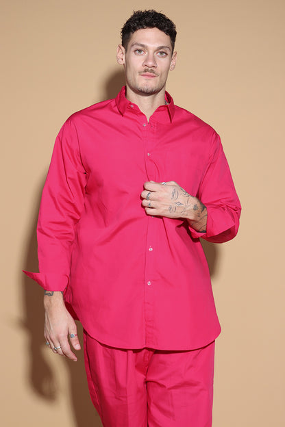 With a shirt collar and front button closure, the shirt in a luxe cotton blend is going to be your new favourite. It is accented with contrasting details showcasing your penchant for details, allowing you to make a statement in style with substance that demands a second look.  The pants have an elasticated waist and a drawstring to adjust it however you like. . Embrace your inner barbie with this pink set