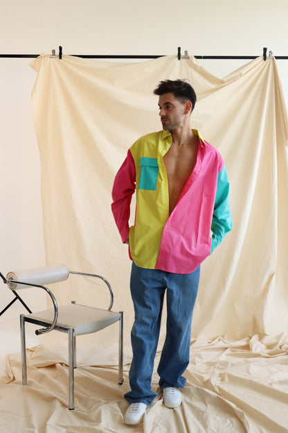 Person wearing multi coloured relaxed fit button up shirt with three colours and full sleeves in cotton with white cotton summer shorts