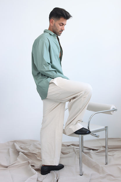 green shirt with printed trims and extra long cuff in a cropped shirt with button down and collar