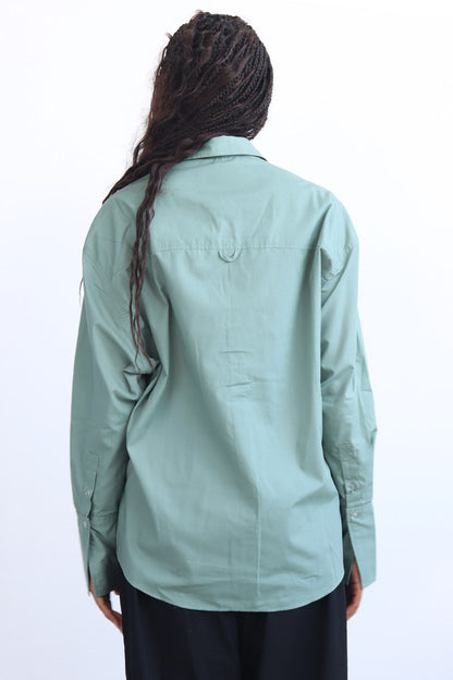 green shirt with printed trims and extra long cuff in a cropped shirt with button down and collar