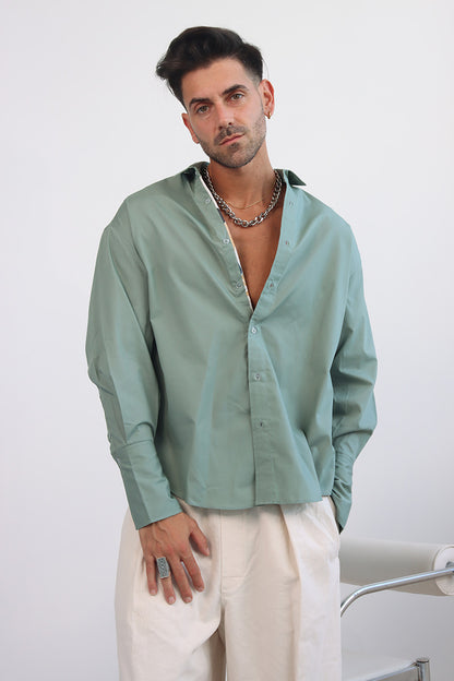 green shirt with printed trims and extra long cuff in a cropped shirt with button down and collar