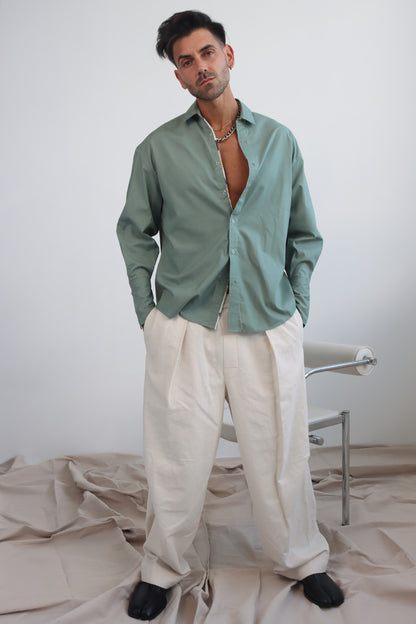 green shirt with printed trims and extra long cuff in a cropped shirt with button down and collar