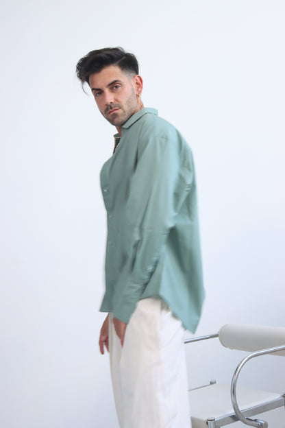 green shirt with printed trims and extra long cuff in a cropped shirt with button down and collar
