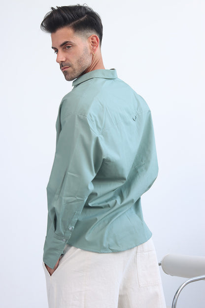 green shirt with printed trims and extra long cuff in a cropped shirt with button down and collar