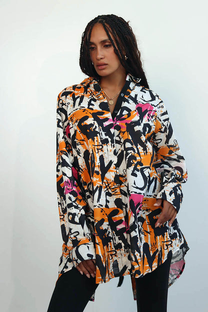 Graffiti print shirt with front button down and full sleeves with black ribbon trims and back tie with eyelets