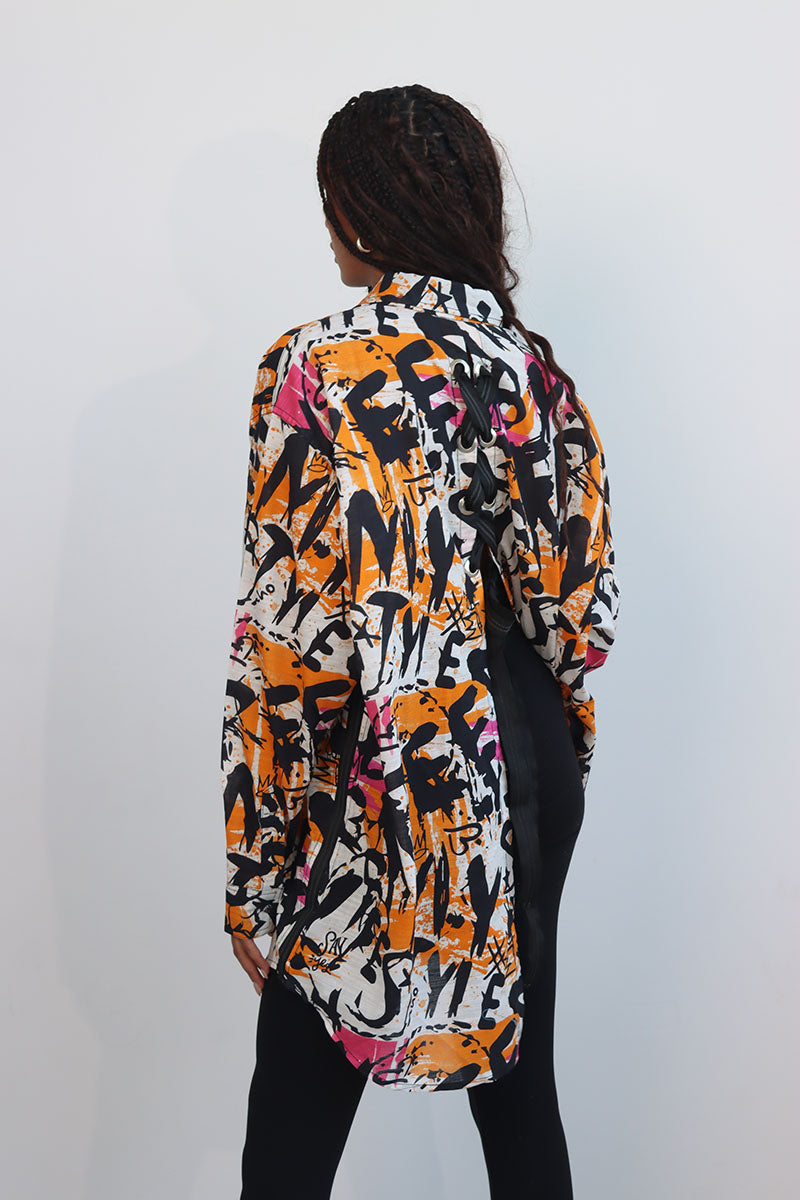 Graffiti print shirt with front button down and full sleeves with black ribbon trims and back tie with eyelets