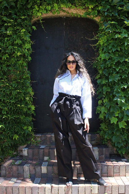 Being in Business never looked this hot. This Benny shirt combines business and party all in one look, perfect for the season. The cotton shirt in blue stripes features a shirt collar and front button closure. Keeping it easy, the shirt has a relaxed silhouette and raglan dolman sleeves to keep it cool and breezy during the hotter season. Be it a business brunch or after work drinks, the shirt keeps your style in check.