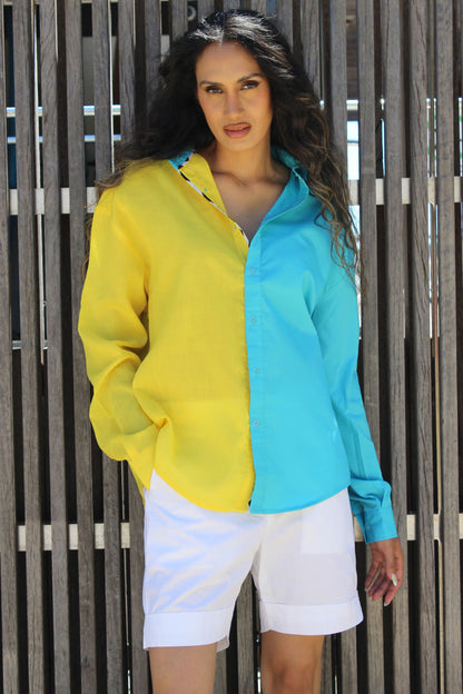 The easy summer shirt that is striking as it is bold in its approach. The oversized 90s referenced Cyrus Shirt is a two toned shirt in Cotton with a shirt collar and cuffed sleeves. In bright tones perfect for a sunny side day, the shirt has black and white trims that give it an extra edge and detail that you might not find somewhere else. Devil surely is in the details. A front button down and style it with Bliss shorts or pants for an easy statement look.